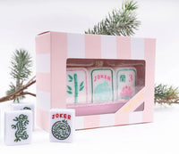 Display your love for mahjong during the holidays with our stunning Mahjong Tile Glass Ornament. We've paid careful attention to detail, crafted from hand-painted imported glass and designed here in the USA. 

 4.5” x 1.5" x 2.5" Glass Hand Painted Boxed for easy gifting! All ornaments come ready to hang with metallic string attached.