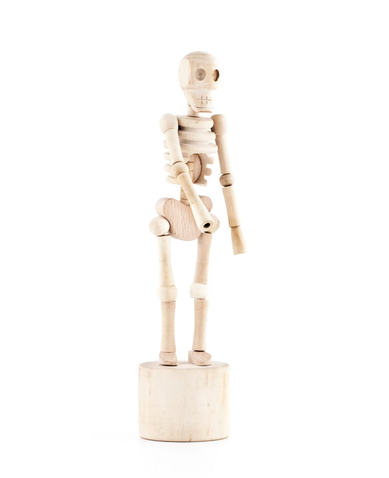 This wooden sculpture is strung togehter like a marionette from wihtin its skeletal frrame. Press the button at the base and the standing skeleton will collapse and dance.
Design: Chris Collicott
Materials: Wood, bean bags
Packaging: kraft window box
Dimensions: 19 x dia. 4,6 cm