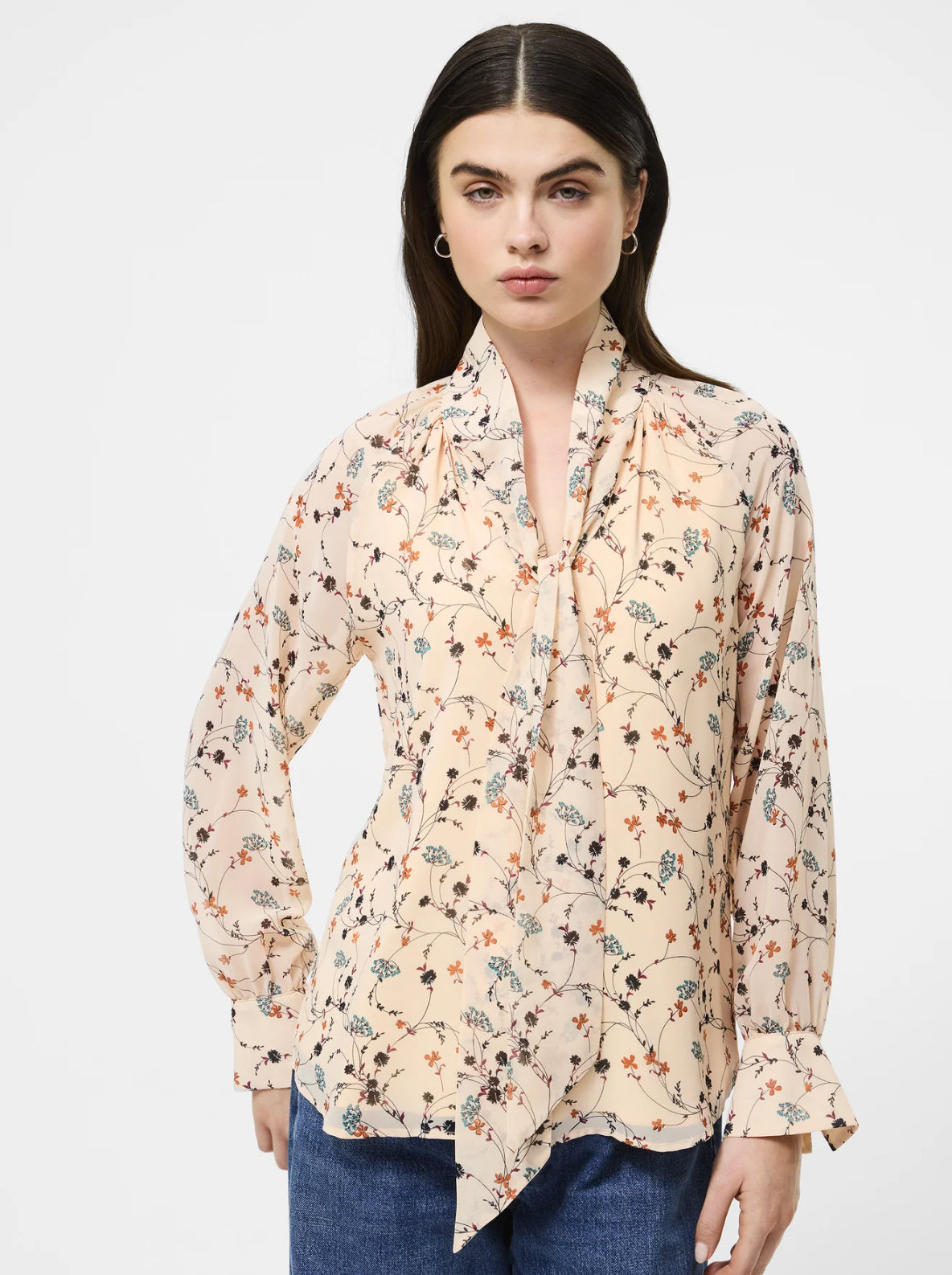 The Leithia Wispy Chiffon Neck Tie Top brings a modern boho feel to your fall lineup. Printed with an autumn-inspired floral on a cream base, it features an airy chiffon silhouette and an attached neck tie you can style your way—bowed, knotted, or left loose. Just add denim or suede and you’re set.

Top
Fabric: airy, lightweight, flowy, floral print, cream + brown
V-neckline
Self tie attached at neck
Long sleeve with flared cuffs
Our model is 5ft7.5" and wears a Size S