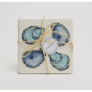Coaster -

Sold Separate Earthenware Coaster Set with Oysters Design
Each set comes raffia wrapped ready to give as a hostess gift or put on display.
Rubber Cushion Stoppers to Prevent Slipping or Tabletop Damage