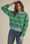 This fuzzy textured green and blue floral sweater has a relaxed fit rubbed collar, neckline, cuffs  and hem. 
The warm blue and vibrant green flowers make add the perfect amount of color and fun to fall and winter. 