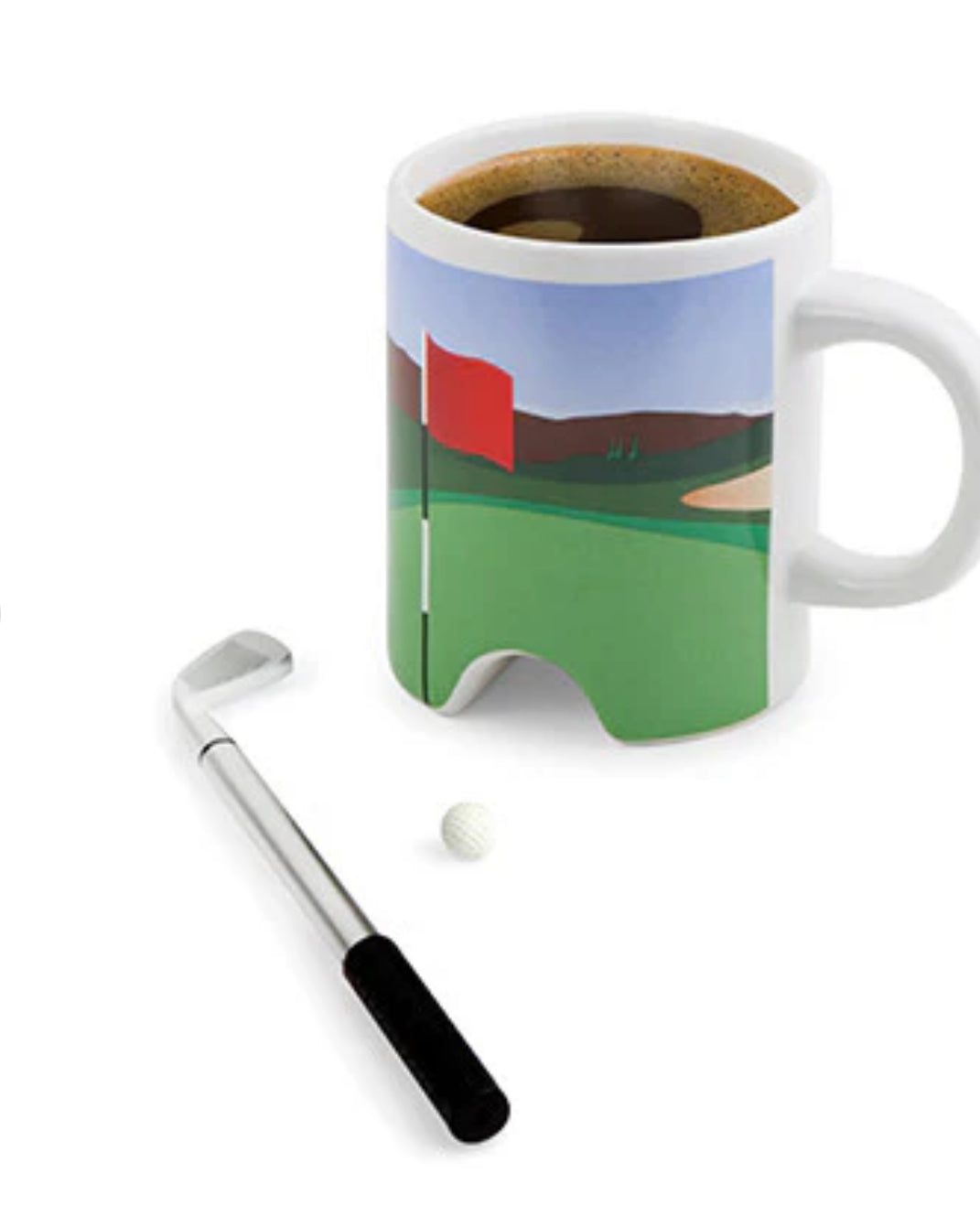 Showing the mug full of coffee and the golf ball and club ready to putt 