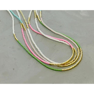 Our  necklace is handcrafted with a touch of gold in a minimalist style.   

•Seed beads in your choice of color combination 
•Hand strung in a modern pattern
•14kt Gold-Filled beads & spring clasp

•16 or 18 inch in length with an optional 2 inch extender 