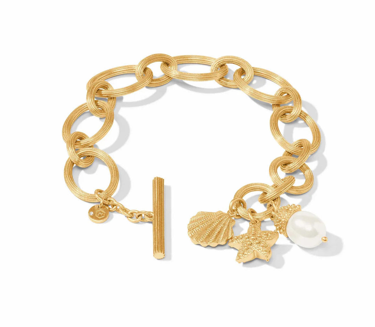 Gold chain bracelet with charms on a white background