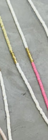 White necklace shown 