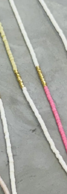 White necklace shown 