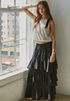 Shown with a black tiered skirt 