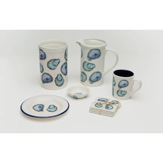 No shuck needed for this coastal oyster see.  White base with purple and blue painted  oysters.  Whole collection shown. Croc, pitcher, coaster, mug, tasting dishes 