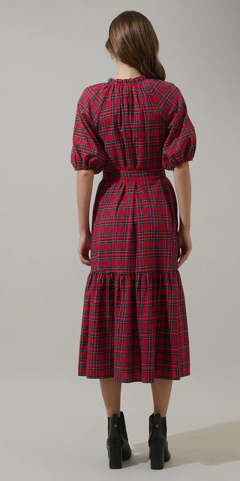 Fall vibes. The Chapman Plaid Wynette Tiered Midi Dress has a pretty red multi design. Billowing puff sleeves join a classic style mid length dress with a functional button front. A waist tie adds shape, framing conventional side seam pockets. Pair the look with boots.

- Split neck
- Button front
- Tie belt
- Tiered
- Color: Red Multi

Size + Fit
- Model is 5'9" and wearing size XS
- Measurements taken from size S
- Chest: 19 3/4"
- Length: 49"