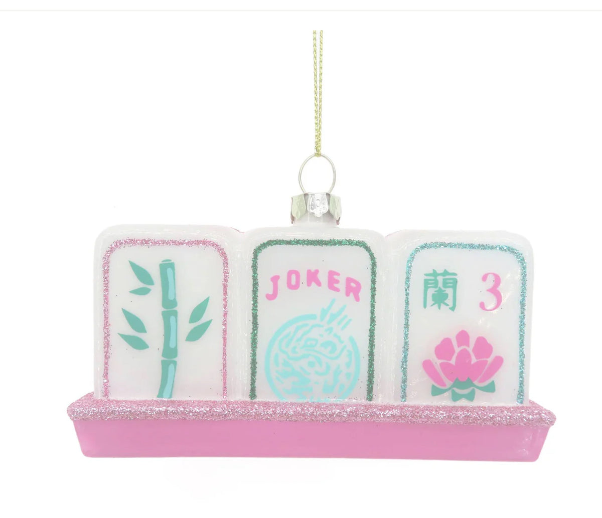 Display your love for mahjong during the holidays with our stunning Mahjong Tile Glass Ornament. We've paid careful attention to detail, crafted from hand-painted imported glass and designed here in the USA. 

 4.5” x 1.5" x 2.5" Glass Hand Painted Boxed for easy gifting! All ornaments come ready to hang with metallic string attached.