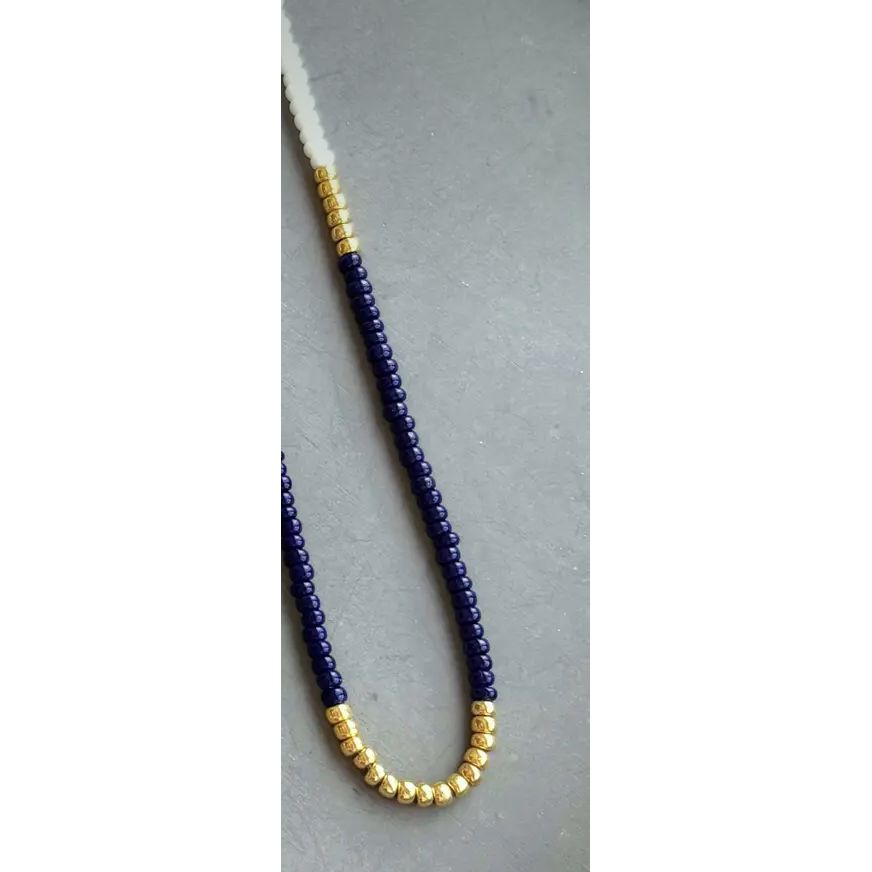 Navy white and gold necklace shown