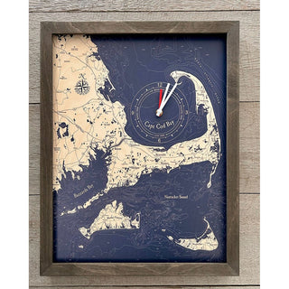 Our Framed tide and time wall  clock features Cape cod and the islands including Wareham, Marion, Mattapoisett, Fairhaven and New Bedford- all of Buzzards Bay. 
Nautical Framed Tide and Time Clock of Cape Cod Details:

Made of high quality birch
Custom 16"x20" Wood Frame
Details of Depths are Laser-Cut
Names and Locations Engraved
Powered by a single AA battery
Ready to hang