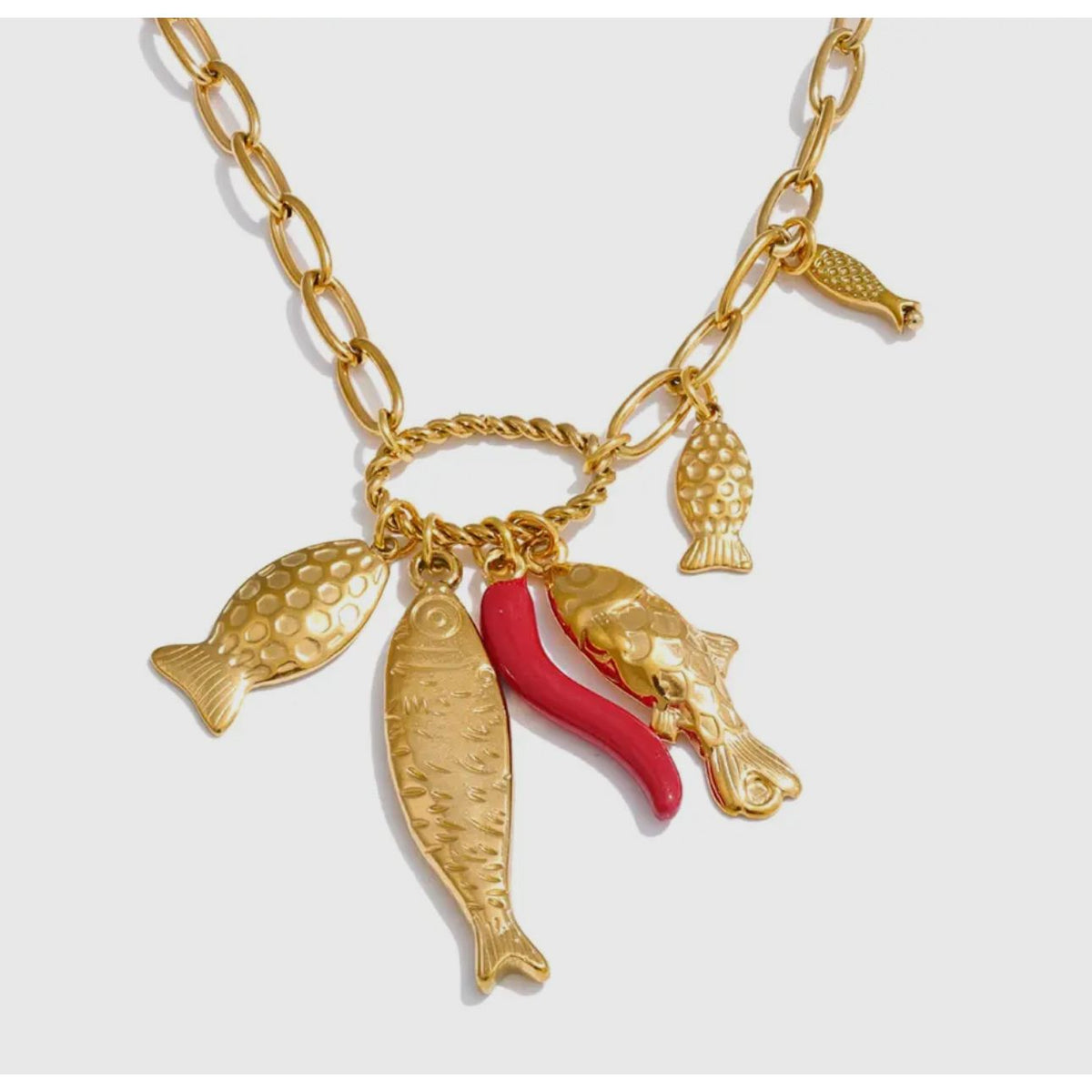 18k gold plated adjustable necklace with 4 detailed sardines with an orange coral charm in between.  Waterproof. Delicate, coastal elegance 