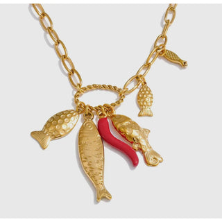 18k gold plated adjustable necklace with 4 detailed sardines with an orange coral charm in between.  Waterproof. Delicate, coastal elegance 