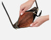 Showing inside compartments for credit cards and zip closure 