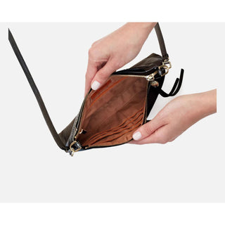 Showing inside compartments for credit cards and zip closure 