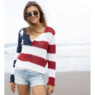 Your search for the perfect patriotic top is over. Meet our top selling Flag V. The relaxed fit top and fitted sleeve is flattering and easy at the same time. Knit in our super soft and lightweight cotton blend yarn. Blue and white Stars on top right corner and fear of sweater is red and white thick striped

Composition: 60% cotton, 40% acrylic