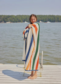 Showing the blanket wrapped on girl on dock 