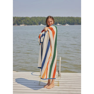 Showing the blanket wrapped on girl on dock 