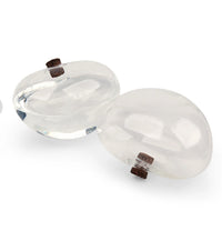 Keep your plants perfectly watered! Water From A Stone slowly lets water out into your planter over the course of 3-4 days. A useful addition to any gardener's home. Made from hand-blown glass. Holds 7oz (207ml) of water. Instructions are: 1. Remove the cork and fill the stone with clean water and replace the cork. 2. Turn over and test to make sure water is coming out of the water release hole. 3. Place the stone in your planter with the cork facing down. 4. Make sure the stone is placed on a level surface