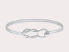 Hand crafted in New England, made of 14k gold and sterling silver.  The Fisherman's Knot is a timeless piece of jewelry that symbolizes eternity and everlasting love. It is great to add to your Cape Cod jewelry collection or wear on it’s own. This classic, simple design will make this bracelet a treasured piece. We are proud to offer authentic the Cape Cod jewelry collection.   Silver shown 