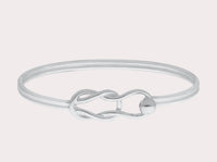 Hand crafted in New England, made of 14k gold and sterling silver.  The Fisherman's Knot is a timeless piece of jewelry that symbolizes eternity and everlasting love. It is great to add to your Cape Cod jewelry collection or wear on it’s own. This classic, simple design will make this bracelet a treasured piece. We are proud to offer authentic the Cape Cod jewelry collection.   Silver shown 
