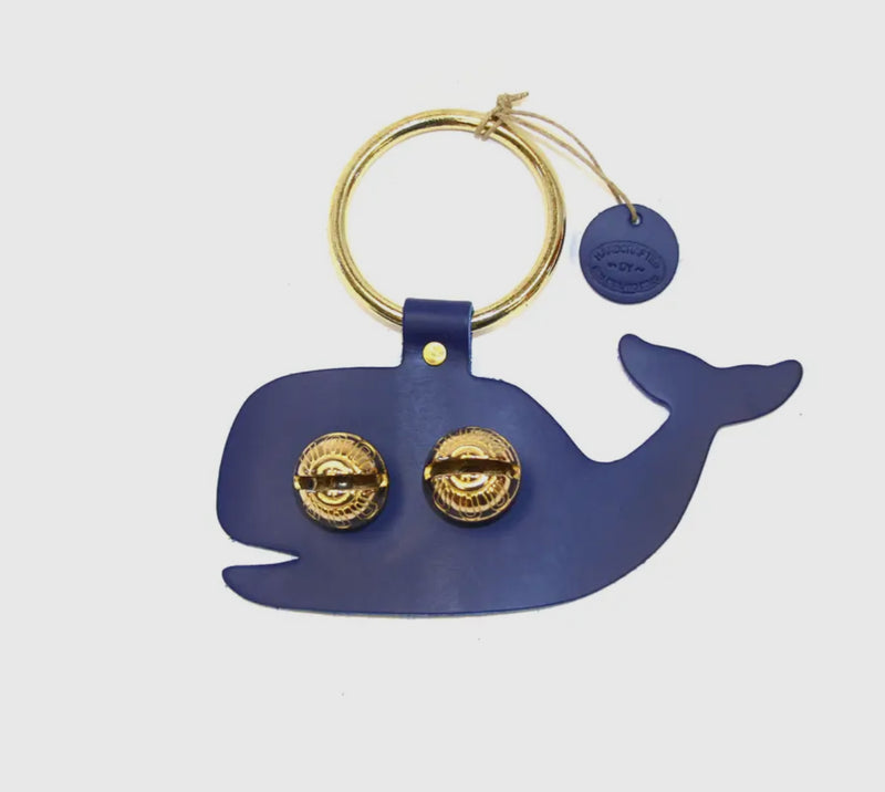Blue whale shown

Each of these creations are stamped out of authentic leather. We then use an old-fashioned, foot powered, riveter to attach the 2 1/2” ring.

After the ring is attached, we add two of the popular #1 bells, with easy to remove, patented design pins, for quick cleansing. Each product has a hand punched and stamped leather tag affixed to the ring.