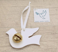These lovely Dove keepsake bells make a perfect small gift. The Dove has a white ribbon and can be hung up in a special place as a reminder of the time shared with you. Doves are a sign of Peace, Love and Hope. They are about 4" wide and 3" tall. These are made in white leather and your choice of a brass or silver (Nickle plated) bell. 