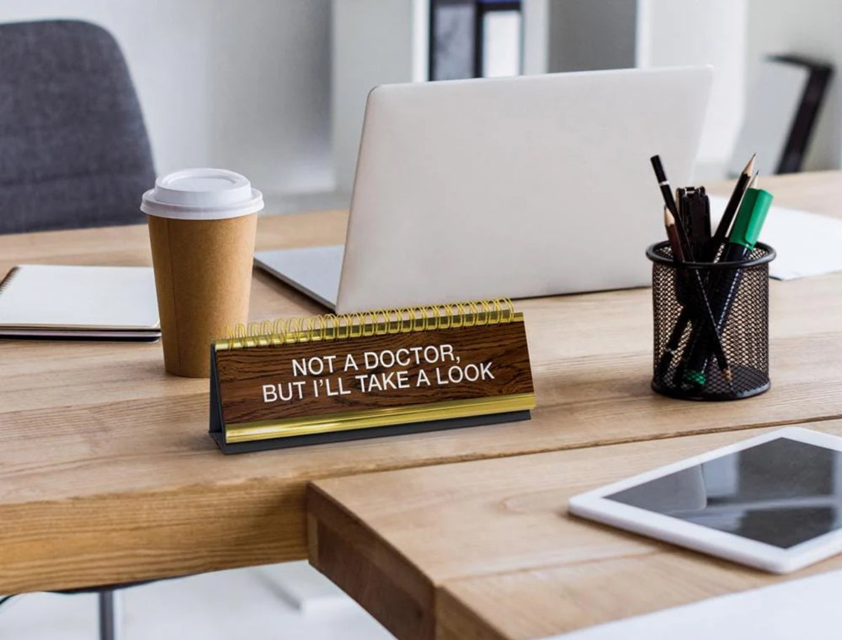 CEO of the fun desk club.
We get it. You’re kind of a big deal and want your desk to reflect that. Fred’s Daily Desk Plaque shows off your witty side and alerts your workmates about how you’re feeling. The desktop flip book contains 50 titles and phrases so there is always one to fit your vibe.
Please note: this product contains swear 