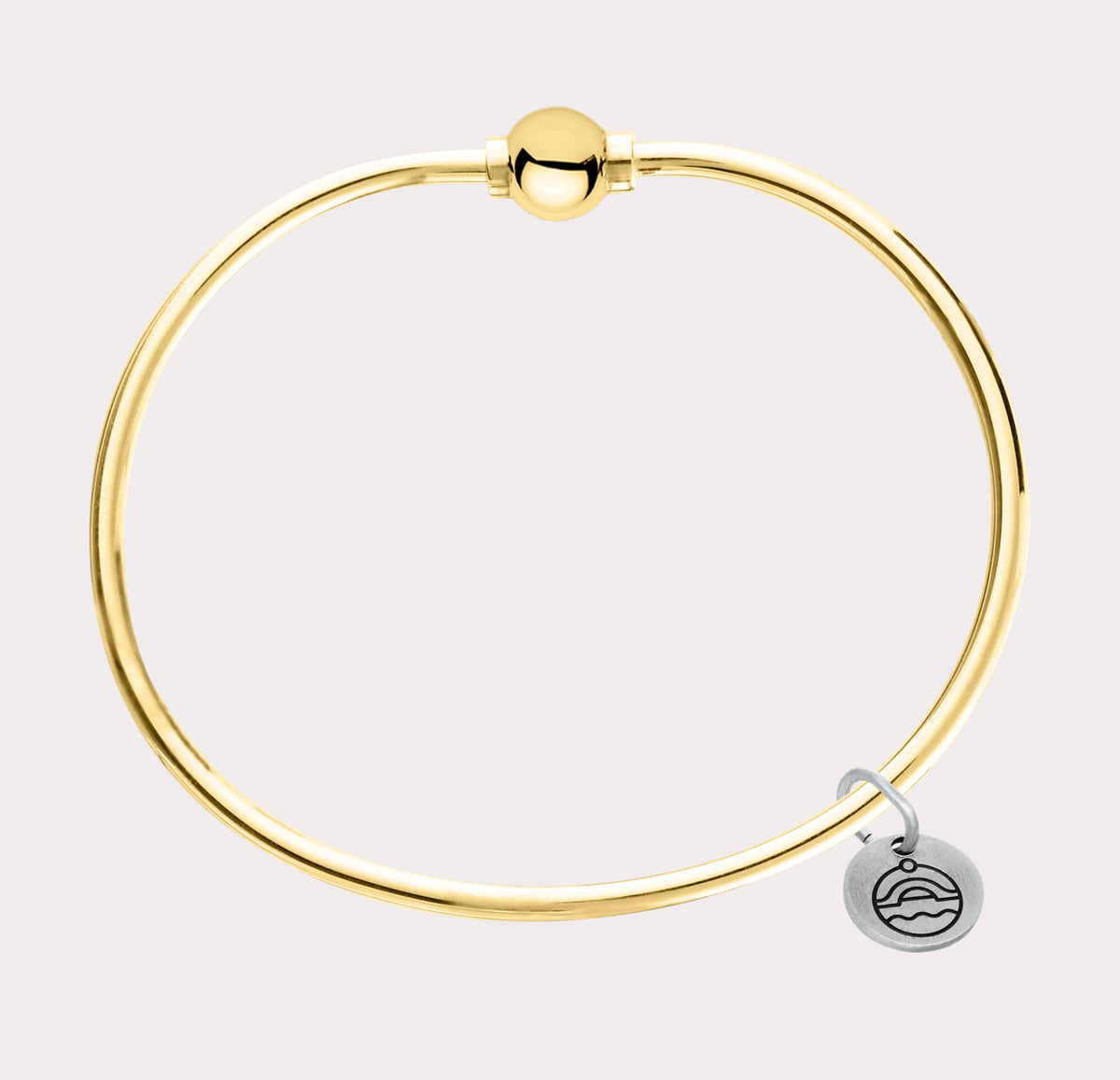 The original design of the Cape Cod Jewelry®️ line, with a sterling silver bangle and single ball available in sterling silver, 14k yellow gold. 