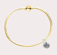 The original design of the Cape Cod Jewelry®️ line, with a sterling silver bangle and single ball available in sterling silver, 14k yellow gold. 