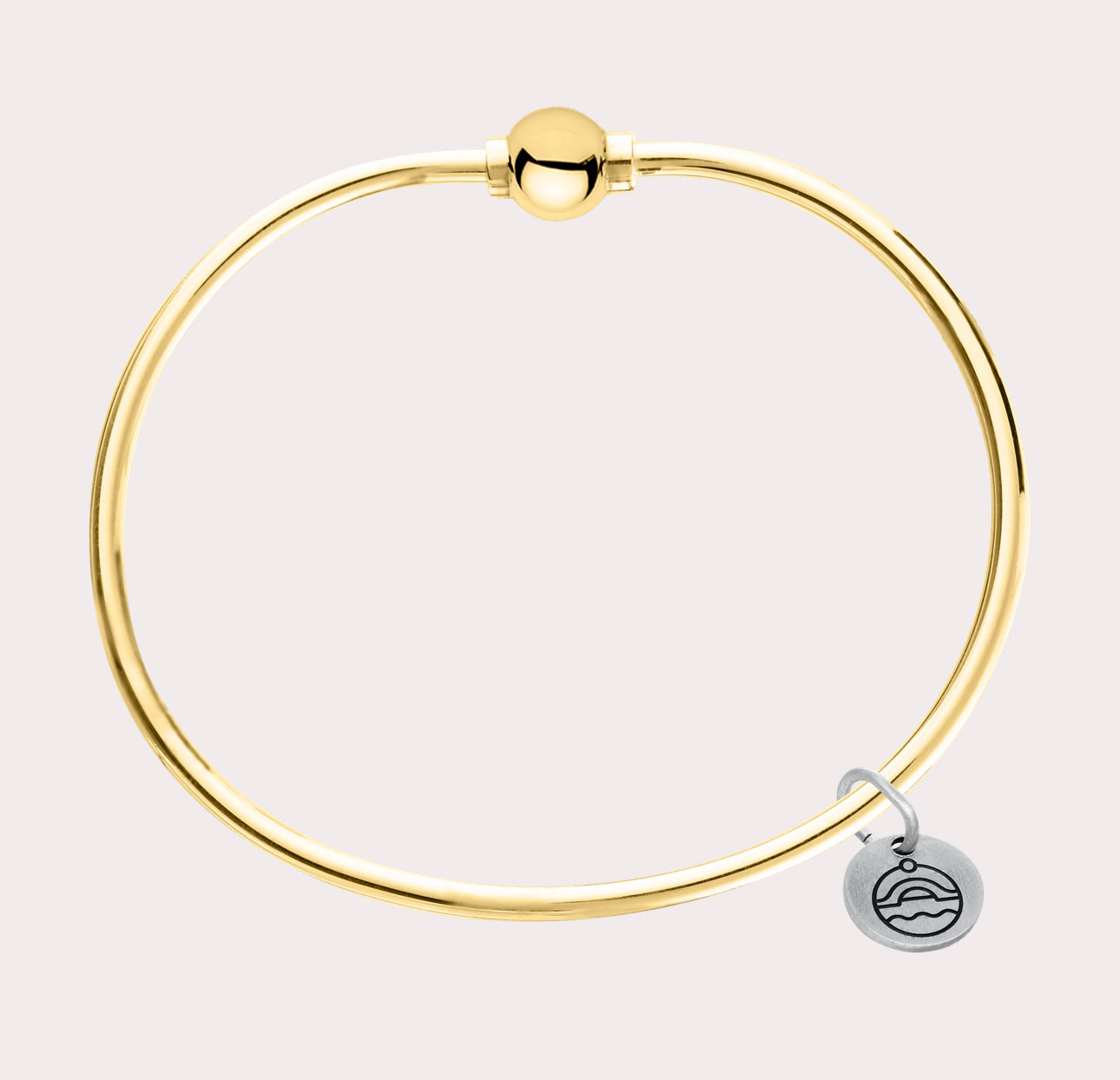 The original design of the Cape Cod Jewelry®️ line, with a sterling silver bangle and single ball available in sterling silver, 14k yellow gold. 