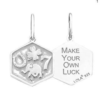 Charm shown in silver 

ever give up and good luck will find you. - The Neverending Story

MAKE YOUR OWN LUCK

Sterling silver.This tag is a hexagonal shape and is approximately 1/2" across.