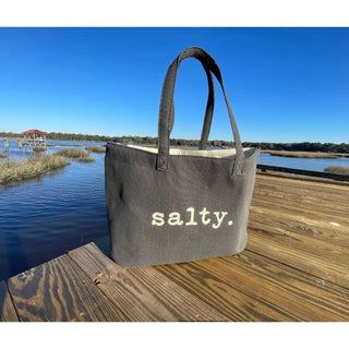 This top selling bag is perfect for days on the beach, boat or running errands.  

Durable cotton canvas bag imprinted with the words, "SALTY". Thick & cushioned 12" Shoulder length handles
Dark grey shown 