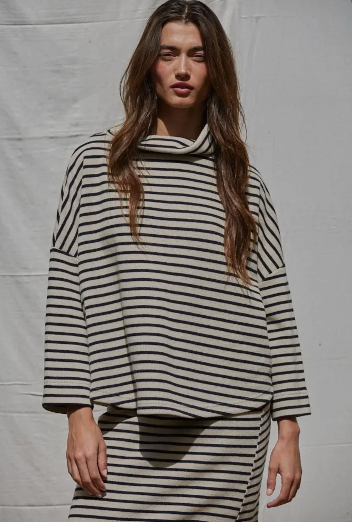 This oversized turtleneck was willing right out of the box. We love it with the matching skirt or your favorite pair of denim.  


hand wash 

cotton/rayon blend 