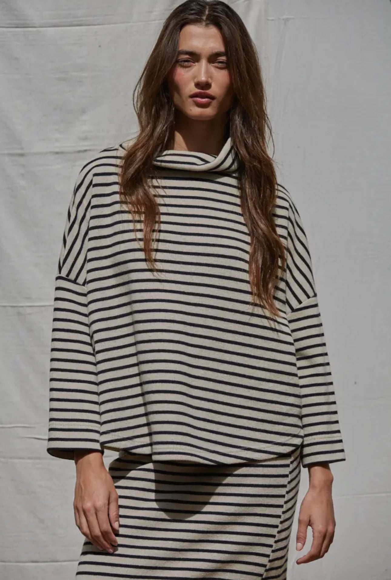 This oversized turtleneck was willing right out of the box. We love it with the matching skirt or your favorite pair of denim.  


hand wash 

cotton/rayon blend 