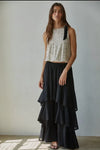 This sleeveless crop top combines woven polyester spandex fabric with a shimmering sequin finish for a blend of comfort and style. Featuring a round neckline and a delicate bow trim, it offers a polished look, while the elasticband hem ensures a secure fit. The back keyhole detail adds subtle elegance, and the rayon spandex lining provides smooth wearability. Ideal for occasions that call for a sophisticated yet playful 