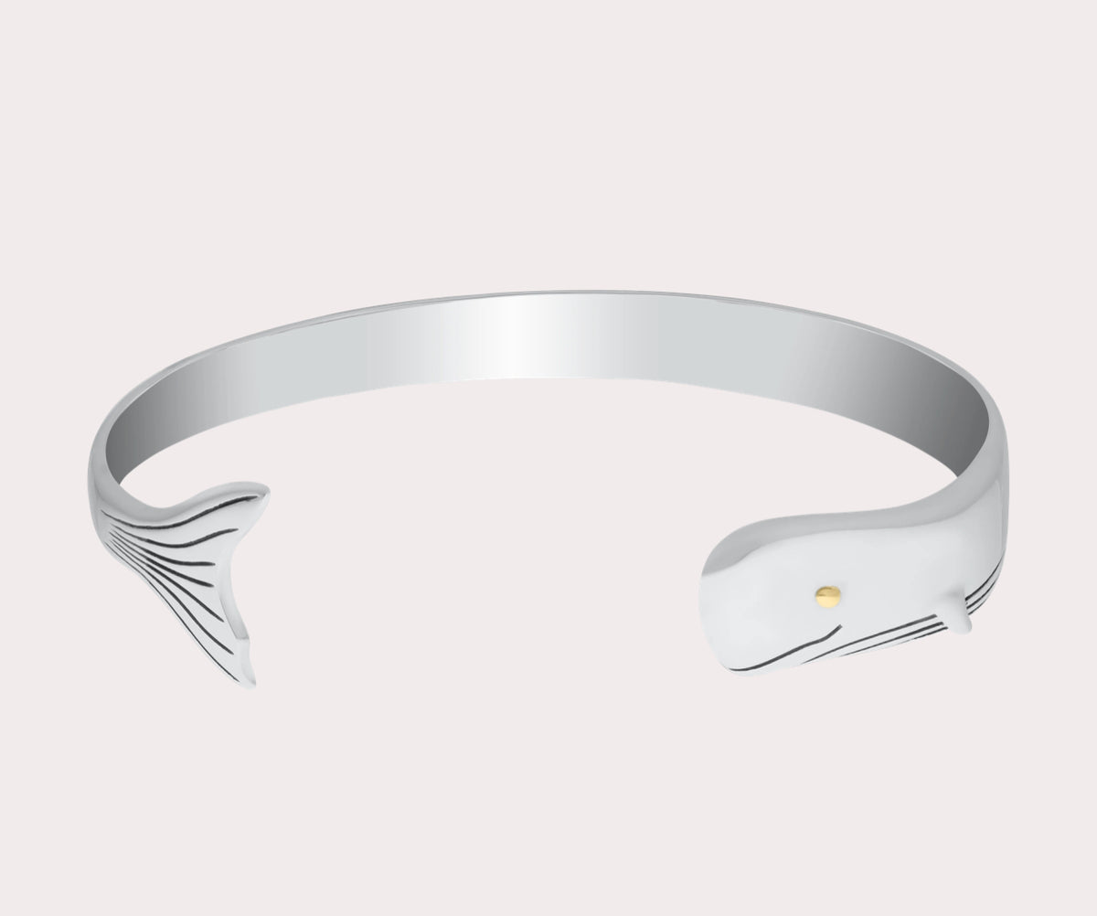 This sterling silver whale cuff with a vermeil eye is sure to add a splash of nautical elegance to any look.

Sterling silver with a 14k gold eye 
Authorized LeStage dealer 
