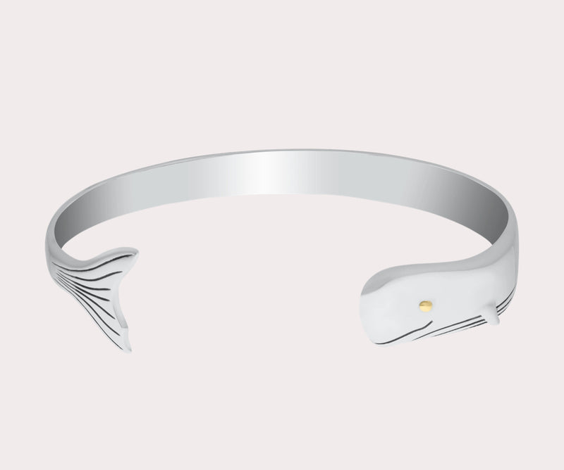 This sterling silver whale cuff with a vermeil eye is sure to add a splash of nautical elegance to any look.

Sterling silver with a 14k gold eye 
Authorized LeStage dealer 