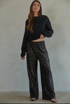 Disco Vibes! Turn heads with these twinkling sequin flashback pants that exude disco vibes. Featuring all over black sequin these pants are sure to turn heads! 

This item is new, buy now before it's too late! 

*Eligible for returns. If you are not completely satisfied, you may return your purchase for a credit or refund. Items that cannot be returned are marked as Final Sale. See Details.

Details:

Sequin wide leg pants
Elastic waist band
Polyester lining
Fabric: 95% Polyester, 5% Spandex
Dry clean only 