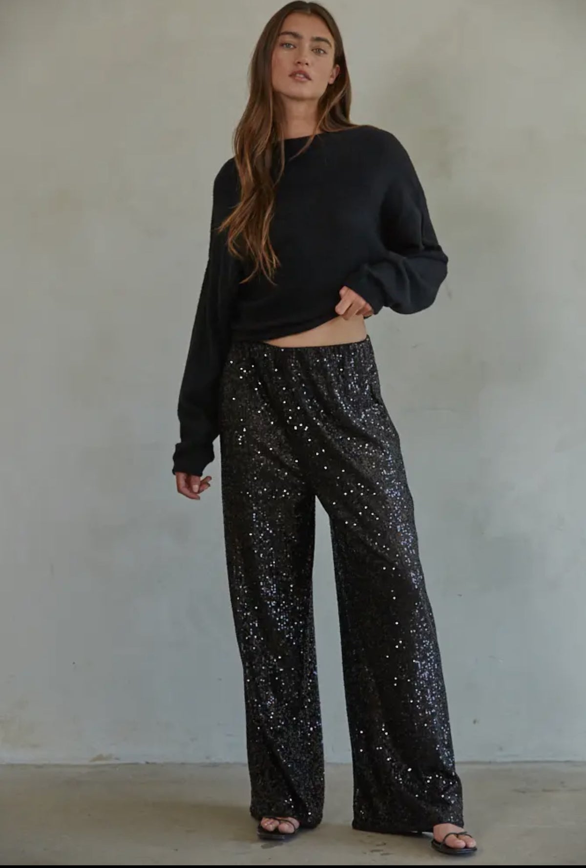 Disco Vibes! Turn heads with these twinkling sequin flashback pants that exude disco vibes. Featuring all over black sequin these pants are sure to turn heads! 

This item is new, buy now before it's too late! 

*Eligible for returns. If you are not completely satisfied, you may return your purchase for a credit or refund. Items that cannot be returned are marked as Final Sale. See Details.

Details:

Sequin wide leg pants
Elastic waist band
Polyester lining
Fabric: 95% Polyester, 5% Spandex
Dry clean only 
