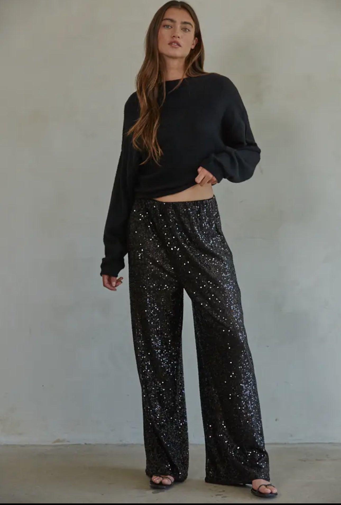 Disco Vibes! Turn heads with these twinkling sequin flashback pants that exude disco vibes. Featuring all over black sequin these pants are sure to turn heads! 

This item is new, buy now before it's too late! 

*Eligible for returns. If you are not completely satisfied, you may return your purchase for a credit or refund. Items that cannot be returned are marked as Final Sale. See Details.

Details:

Sequin wide leg pants
Elastic waist band
Polyester lining
Fabric: 95% Polyester, 5% Spandex
Dry clean only 