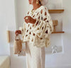 You NEED to see this in person, it is gorgeous!  This long sleeve sweater features a hollow hook design that makes it a bold statement.  It is ideal for elevating your outfit. 
Made in USA 