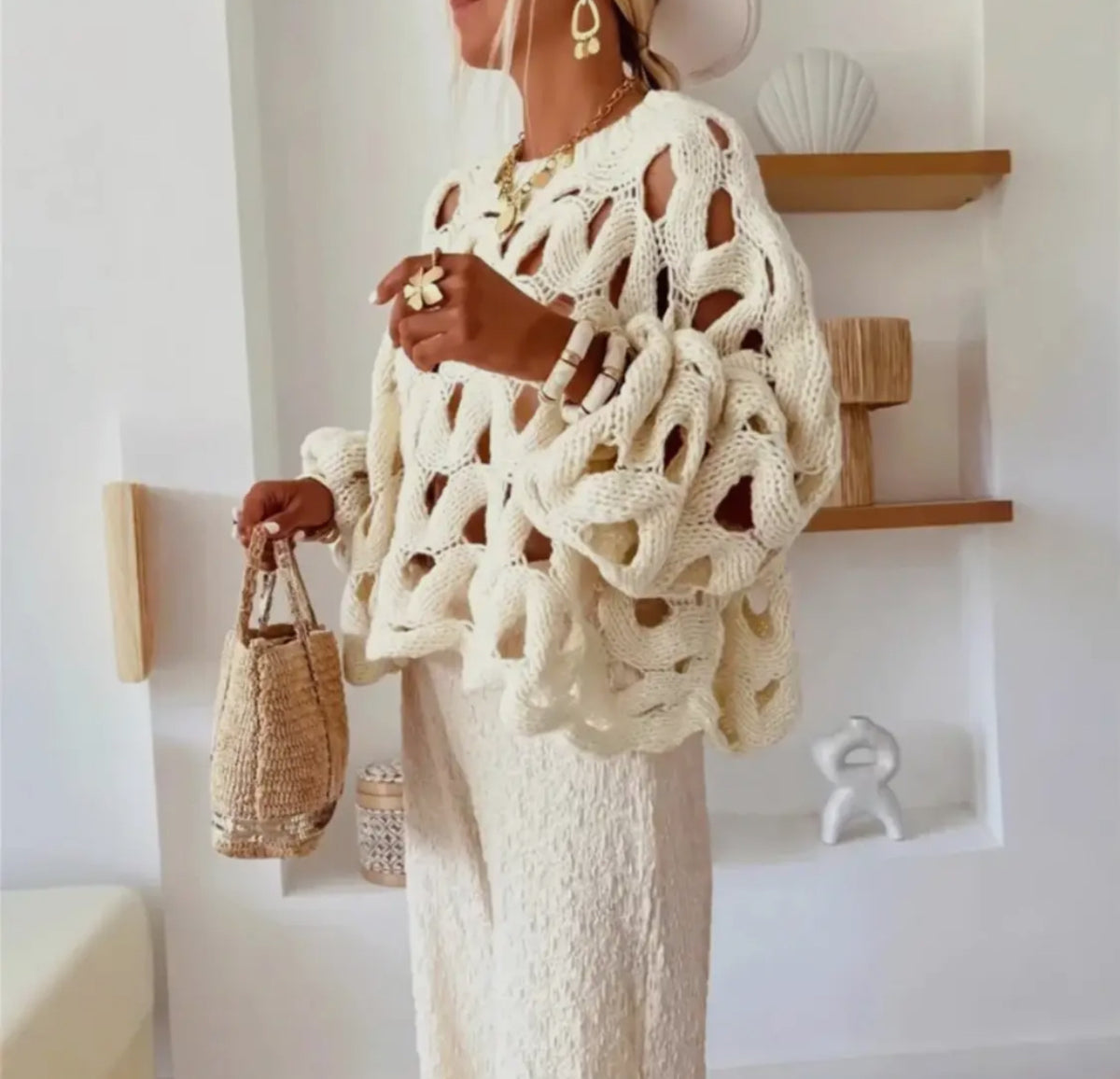 You NEED to see this in person, it is gorgeous!  This long sleeve sweater features a hollow hook design that makes it a bold statement.  It is ideal for elevating your outfit. 
Made in USA 