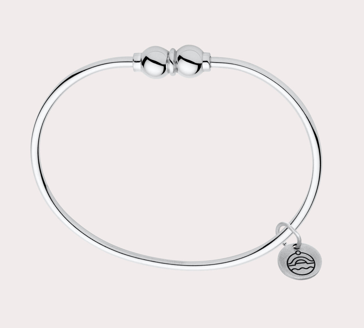 Add to your original design collection of the Cape Cod Jewelry®️ with a sterling silver bangle and double  ball available in sterling silver, 14k yellow gold. Silver shown 